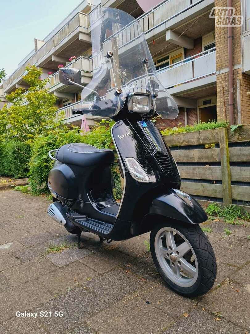 Piaggio Vespa 2012 y Scooter / moped