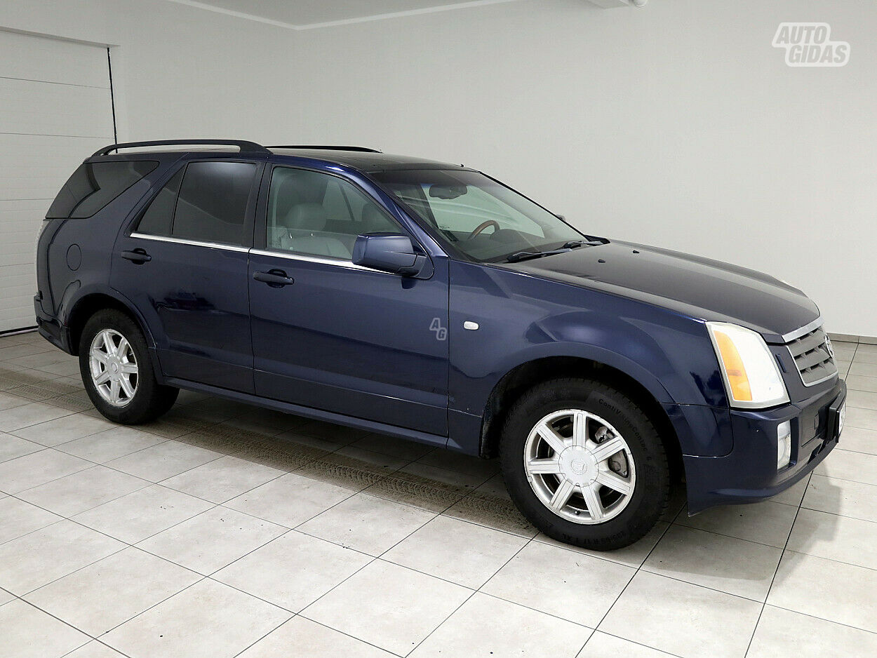 Cadillac SRX 2005 y Van